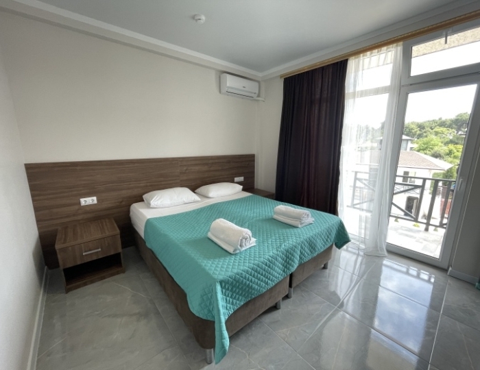 Четырёхместный люкс с балконом - Отель «Бугенвиллея» Пицунда